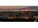 Beautiful city view at dusk with lights twinkling from the surrounding neighborhood at 2899 Brook Trout Ct, Henderson, NV 89052