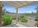 Inviting covered patio with a pergola and views of the surrounding desert landscape at 2899 Brook Trout Ct, Henderson, NV 89052