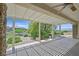 This covered patio offers shade and landscaping for outdoor relaxation and entertainment at 2899 Brook Trout Ct, Henderson, NV 89052