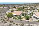 Beautiful backyard view of landscaped property with retaining wall and partial desert landscape at 2899 Brook Trout Ct, Henderson, NV 89052