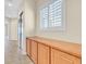 Tile floor hallway with a window, closet, and built in cabinets at 2899 Brook Trout Ct, Henderson, NV 89052