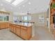 Open kitchen with granite island, stainless appliances, and breakfast nook at 2899 Brook Trout Ct, Henderson, NV 89052