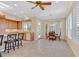 Bright kitchen boasts a breakfast nook, tile floor, and wood cabinetry at 2899 Brook Trout Ct, Henderson, NV 89052
