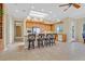 Bright kitchen with island has stainless appliances, skylight, and breakfast bar at 2899 Brook Trout Ct, Henderson, NV 89052
