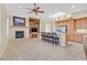 Spacious living room features a fireplace, built-in shelves, and a breakfast bar at 2899 Brook Trout Ct, Henderson, NV 89052