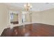 Elegant living area with hardwood floors, chandelier, and seamless flow into the entry at 2899 Brook Trout Ct, Henderson, NV 89052