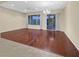 Spacious living room featuring hardwood flooring and sliding glass doors to the outside at 2899 Brook Trout Ct, Henderson, NV 89052