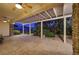 Covered outdoor patio with ceiling fans and views of a well-manicured backyard and landscaping at 2899 Brook Trout Ct, Henderson, NV 89052