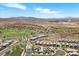 Expansive aerial view showcasing the beautiful community, golf course, and surrounding desert landscape at 3 Vicolo Sebino, Henderson, NV 89011