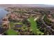 Stunning aerial view of golf course homes surrounded by water and desert landscape at 3 Vicolo Sebino, Henderson, NV 89011