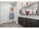 A full bathroom features double sinks, granite counters, tile accents, and modern fixtures at 3 Vicolo Sebino, Henderson, NV 89011