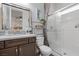A well-lit full bathroom features a shower with glass doors, a large mirror, and modern vanity at 3 Vicolo Sebino, Henderson, NV 89011