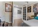 Cozy bedroom featuring double doors, movie posters, and neutral decor at 3 Vicolo Sebino, Henderson, NV 89011