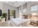 This staged bedroom features recessed lighting, a queen-size bed, and neutral colors at 3 Vicolo Sebino, Henderson, NV 89011
