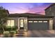 Charming single-story home showcasing a well-manicured yard and a two-car garage with brick driveway at 3 Vicolo Sebino, Henderson, NV 89011