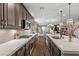 Bright open kitchen features a gas range, stainless steel appliances, and an oversized island for dining at 3 Vicolo Sebino, Henderson, NV 89011