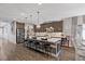 Beautiful kitchen featuring a large island, stainless steel appliances, and luxury vinyl plank flooring at 3 Vicolo Sebino, Henderson, NV 89011