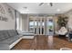 Cozy living room showcasing comfortable seating, french doors to the patio, and luxury vinyl plank flooring at 3 Vicolo Sebino, Henderson, NV 89011