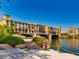 Colorful waterfront condos with arched walkways over the water, and lush landscaping at 3 Vicolo Sebino, Henderson, NV 89011
