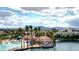 Beautiful aerial view of lakefront community showcasing lagoon, lush greenery and surrounding mountain views at 3151 Soaring Gulls Dr # 1066, Las Vegas, NV 89128