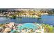 Picturesque aerial view of a lakefront community with a sandy beach lagoon and swaying palm trees at 3151 Soaring Gulls Dr # 1066, Las Vegas, NV 89128