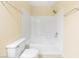 Bathroom with a white tiled shower over tub, toilet and neutral color scheme at 3151 Soaring Gulls Dr # 1066, Las Vegas, NV 89128
