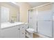 Bathroom featuring a white vanity, toilet, and a glass-enclosed shower at 3151 Soaring Gulls Dr # 1066, Las Vegas, NV 89128
