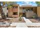 Charming condo exterior with private balcony, concrete walkway, and desert landscaping at 3151 Soaring Gulls Dr # 1066, Las Vegas, NV 89128