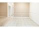 Spacious living room featuring tile flooring, neutral walls, and decorative trim at 3151 Soaring Gulls Dr # 1066, Las Vegas, NV 89128