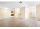 Spacious living room with light-colored wood flooring and a view of the kitchen at 3151 Soaring Gulls Dr # 1066, Las Vegas, NV 89128