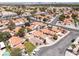 A beautiful residential community with red tile roofs, lush landscaping, and well-maintained streets in a desirable location at 317 Brent Ct, Henderson, NV 89074