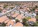 Expansive view of a residential neighborhood with red-tiled roofs, mature trees, and well-maintained streets at 317 Brent Ct, Henderson, NV 89074