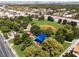 Aerial view of a well-maintained community park with a baseball field, playground, and lush greenery in the background at 317 Brent Ct, Henderson, NV 89074