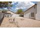 Backyard with gravel, minimal desert landscaping, and a block perimeter at 317 Brent Ct, Henderson, NV 89074