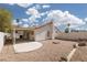 Spacious backyard with gravel landscaping, patio, and privacy wall for outdoor enjoyment at 317 Brent Ct, Henderson, NV 89074