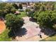 Aerial view highlighting a basketball court nestled in a community park, framed by mature trees and green spaces at 317 Brent Ct, Henderson, NV 89074
