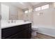Bathroom features modern vanity, a toilet, and shower over tub at 317 Brent Ct, Henderson, NV 89074