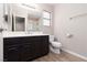 Bathroom features vanity, mirror, toilet, and shower over tub at 317 Brent Ct, Henderson, NV 89074