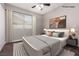 Bedroom featuring a neutral color scheme, a large bed, and natural light from a window at 317 Brent Ct, Henderson, NV 89074