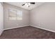 Bedroom features a window and carpet flooring with neutral-colored walls at 317 Brent Ct, Henderson, NV 89074