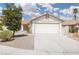 Spacious driveway leading to a two-car garage with a well-kept front yard at 317 Brent Ct, Henderson, NV 89074