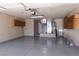 Spacious garage with epoxy flooring, utility cabinets, and installed mechanical systems for convenience at 317 Brent Ct, Henderson, NV 89074