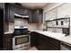 Well-lit kitchen features granite countertops and stainless steel oven and range at 317 Brent Ct, Henderson, NV 89074