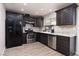 Modern kitchen with stainless steel appliances and granite countertops at 317 Brent Ct, Henderson, NV 89074