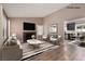 Cozy living room featuring a fireplace, modern furniture, and an open view into the dining area at 317 Brent Ct, Henderson, NV 89074