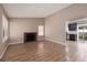 Bright living room boasts new floors and a classic brick fireplace at 317 Brent Ct, Henderson, NV 89074