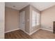 Cozy room features wood floors, a window, and a white door at 317 Brent Ct, Henderson, NV 89074