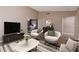 Cozy living room with stylish decor and a view into the modern kitchen at 317 Brent Ct, Henderson, NV 89074