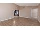 Open living room featuring wood floors leading to kitchen area at 317 Brent Ct, Henderson, NV 89074