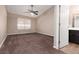 Large main bedroom with carpet and view of bath and walk-in closet at 317 Brent Ct, Henderson, NV 89074